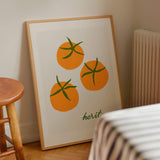 orange tomato art print and vintage green font in pine wood frame in kitchen