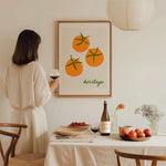dining room framed art print of orange tomato with vintage pool hotel font in green